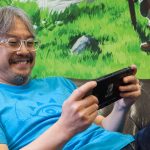 Eiji Aonuma playing a Nintendo Switch