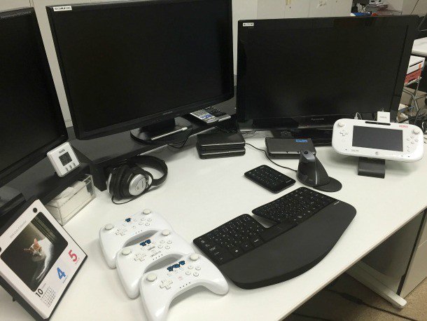 A photo of Sakurai's desk during development of Super Smash Bros. for 3DS and Wii U courtesy of @PushDustin on Twitter.