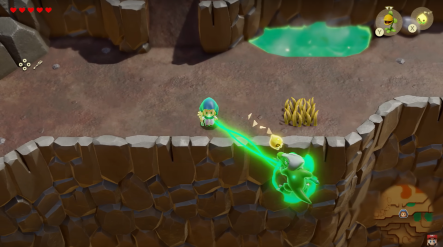 Princess Zelda using her Bind ability to drop a Lizalfos off of a cliff